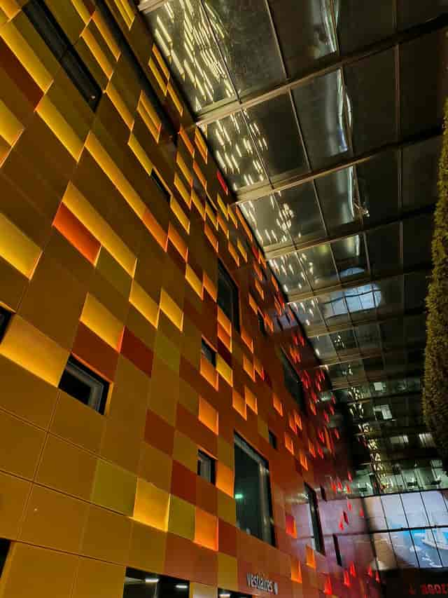 Vibrant Studio 221 venue with illuminated panels for networking and creative events.