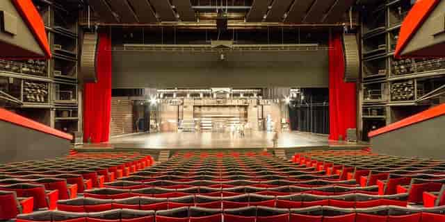 Spacious theater auditorium with tiered seating in Palais des Festivals, Cannes event venue.