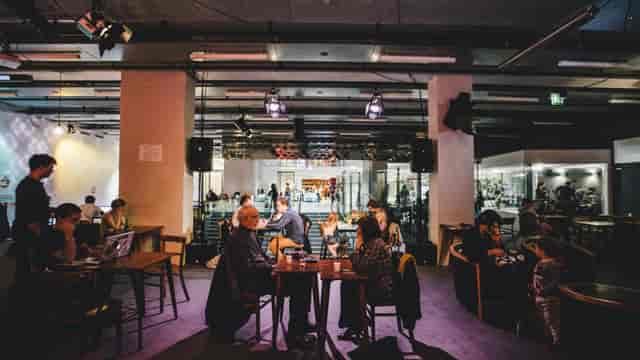 Forum at La Gaîté Lyrique: vibrant meeting space for networking and collaboration events.