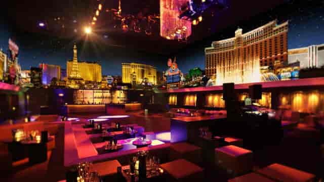Aura Bar Lounge Zurich with DJ area, vibrant for corporate events and parties.