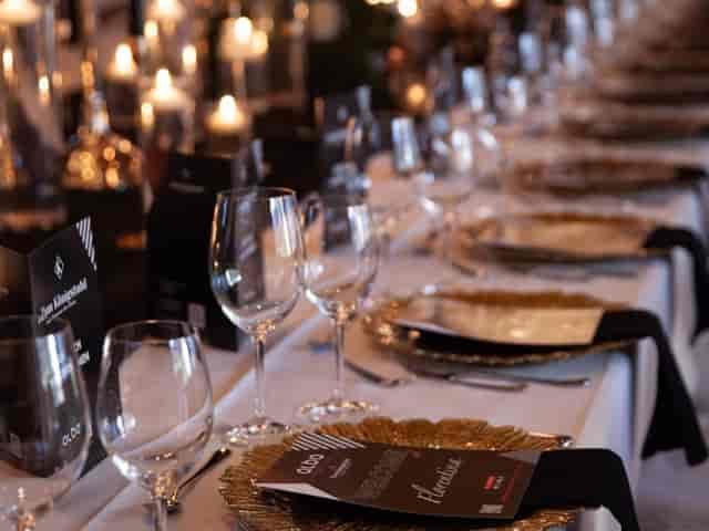 Elegant dining table with gold accents for a formal gala or networking event.
