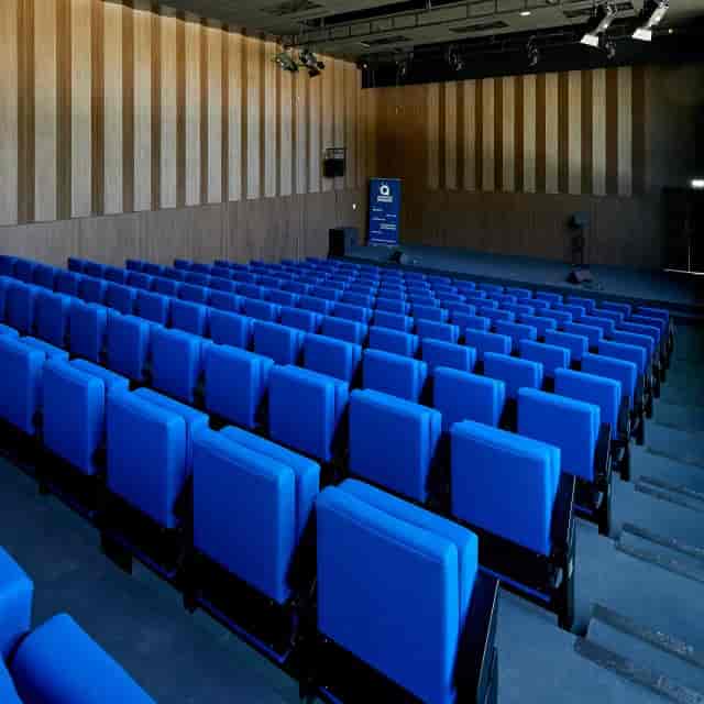 Modern auditorium with blue seating for conferences and presentations at Centre de Congrès d'Angers.