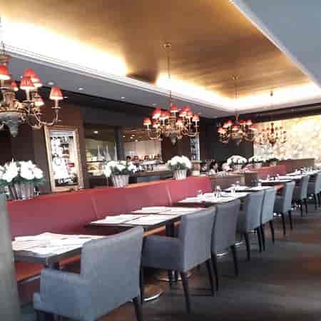 Elegant meeting venue with stylish seating and warm ambiance, perfect for events.