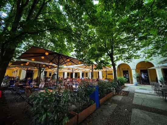 Outdoor restaurant venue at Tempodrom with cozy string lights for gatherings.