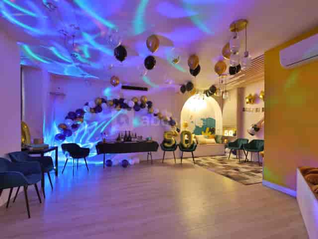 Stylish event space with blue and gold decor for celebrations in Paris 16ème.