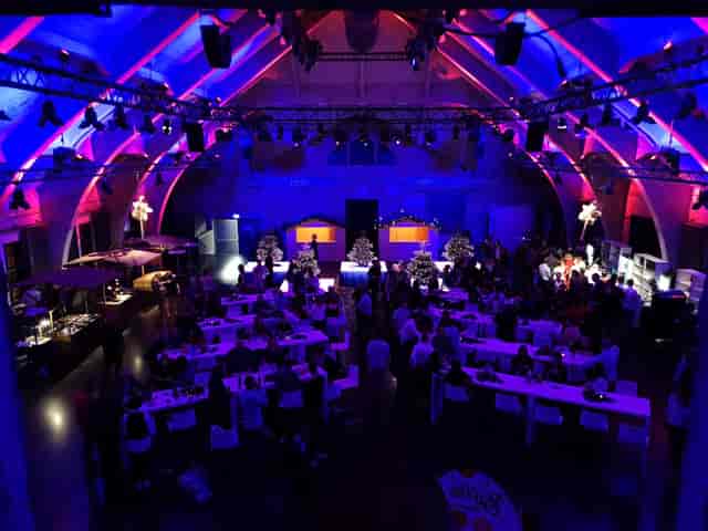 Event space with dramatic lighting for corporate gatherings and celebrations.