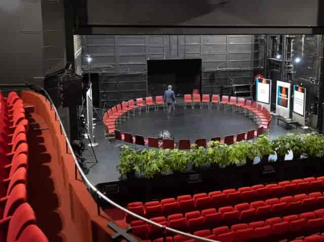 Cresco Auditorium with circular seating, ideal for workshops and panel discussions.