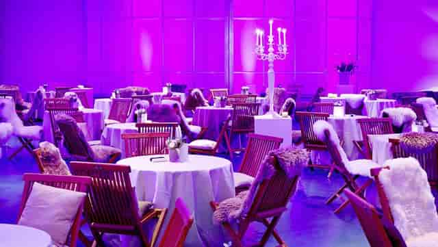 Kunsthaus Zürich Festsaal with elegant tables, purple lighting for upscale events and gatherings.