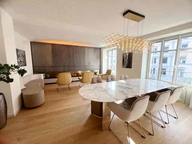 Elegant ACE Zurich meeting room with marble table and natural light for executive gatherings.