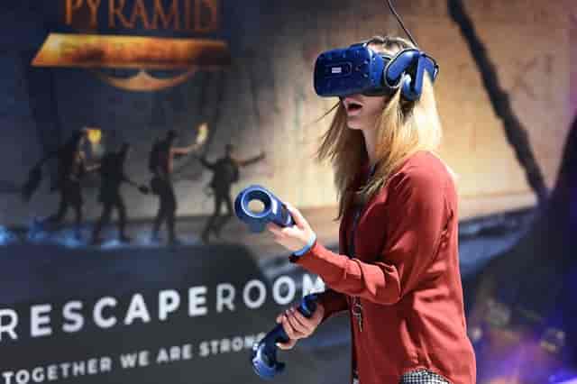 Participant in VR Cube engaging in interactive entertainment for events and team-building.