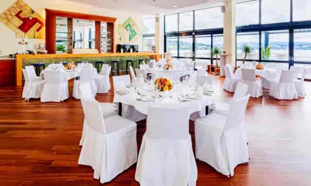 Great Hall in Lake Side with elegantly draped tables for corporate events and fine dining.