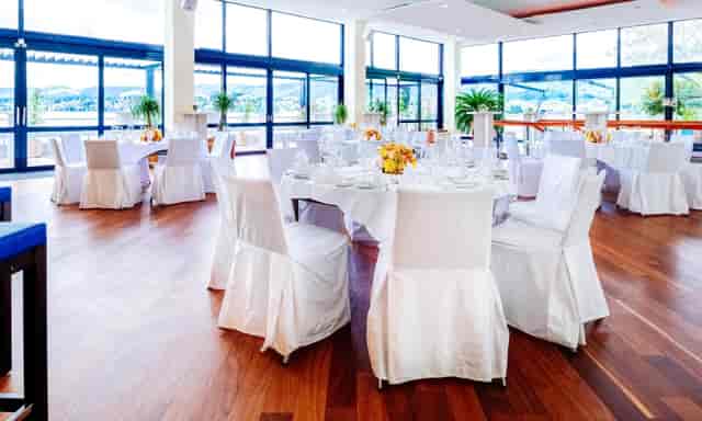 Great Hall at Lake Side with elegant round tables, ideal for corporate events.