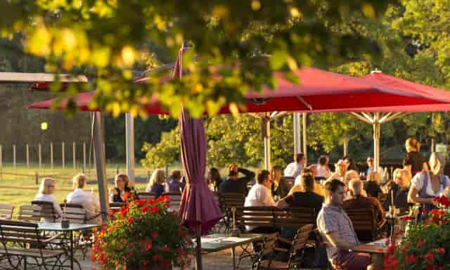 Outdoor seating at Wiesenbeiz, ideal for social events and corporate gatherings.
