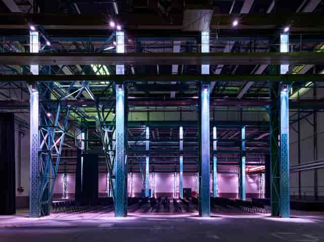 Spacious industrial workshop venue with high ceilings for conferences and events