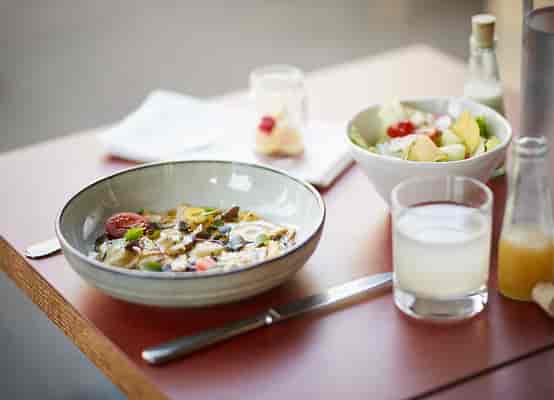 Inviting table setting with healthy dishes for a Zürich networking breakfast.