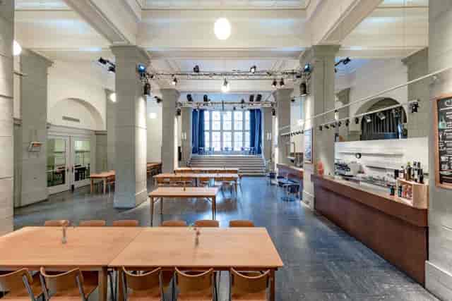 Kalkbreitesaal event venue with large windows, ideal for conferences and gatherings.