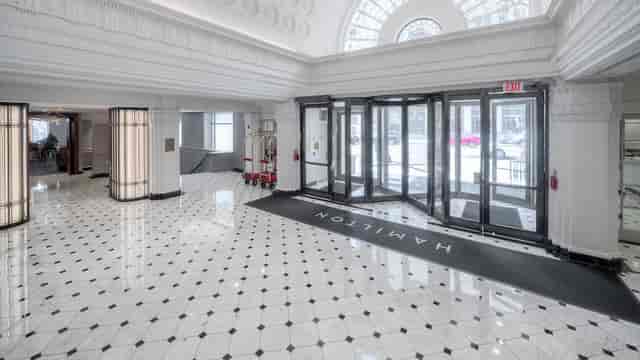 Spacious Hamilton Hotel prefunction lobby, ideal for conferences and upscale events.