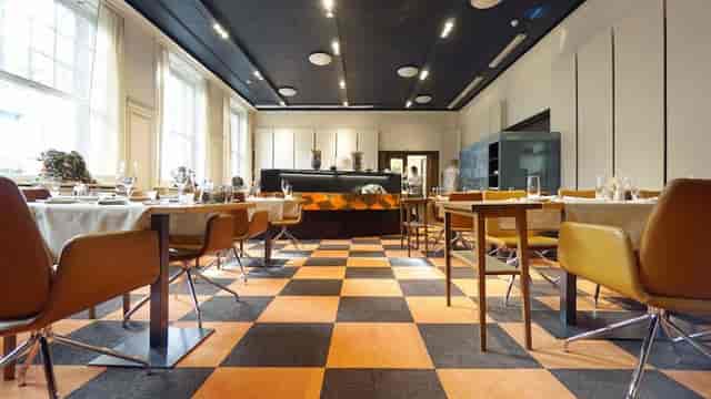 Modern event space in Glockenhof Zurich with checkered flooring for corporate meetings.