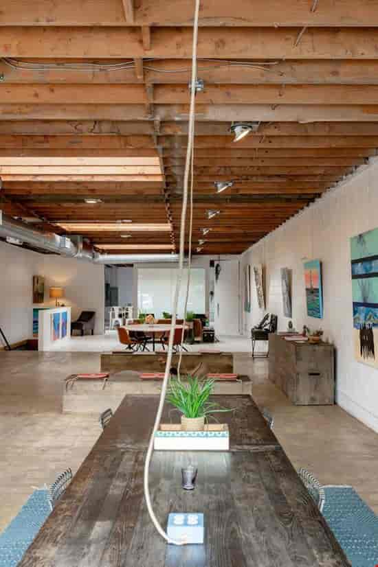 Versatile event space in El Segundo with polished concrete floors, ideal for workshops and meetings.