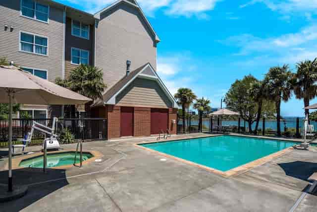 BBQ picnic area with pool at AC Hotel San Francisco, ideal for casual events and networking.