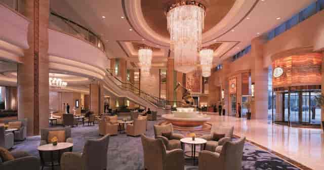 Luxurious Shangri-La Guangzhou event space with elegant chandeliers for meetings and networking.