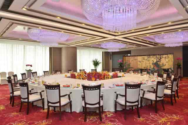 Elegant Garden Grand Ballroom banquet setup for corporate events and formal celebrations.