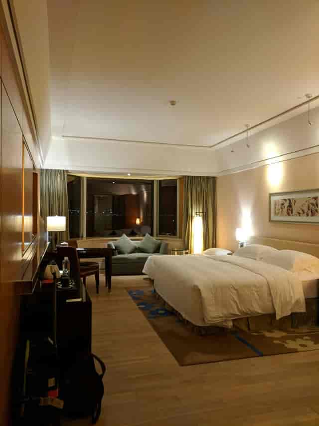 Chrysanthemum hotel room with large windows, ideal for corporate retreats and events.