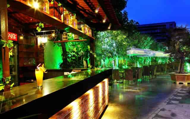 Stylish outdoor garden venue at The Royal Garden Hotel for evening receptions and cocktail parties.