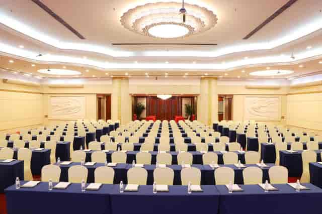 Elegant Guangdong Hotel meeting room for large conferences with organized seating.