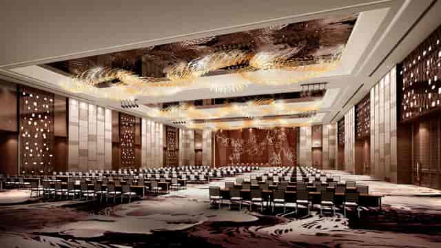 Grand Ballroom at Pullman Guangzhou: elegant venue for conferences with stunning chandeliers.