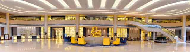 Modern conference room with yellow chairs at Grand Skylight Hotel, ideal for events.