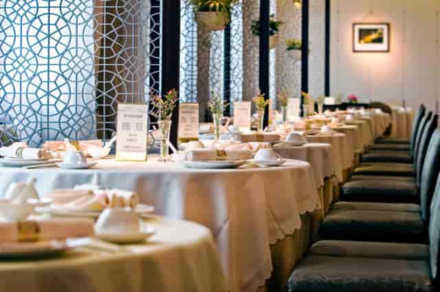 Elegantly set banquet table in Golden Hall at Dong Fang Hotel for upscale events