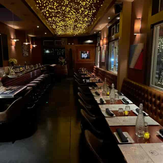 Elegant restaurant interior at Bistro Central Parc, ideal for private dinners and corporate events.