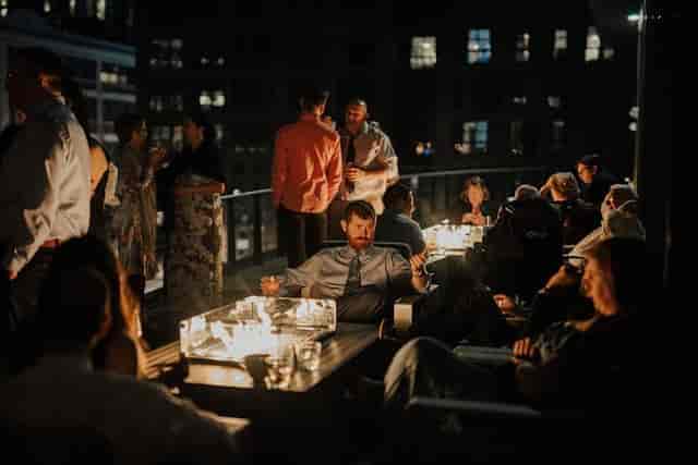 Rooftop event at District Winery with soft lighting and city skyline views.