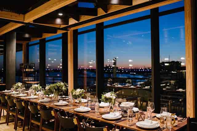 Elegant dining area in District Winery's Portrait Room, perfect for upscale events.