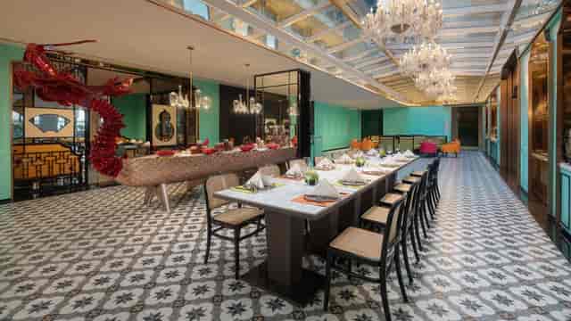 Elegant hotel meeting room with dining table, ideal for upscale events and receptions.
