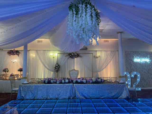 Elegant banquet hall with draped ceiling, perfect for weddings and celebrations.
