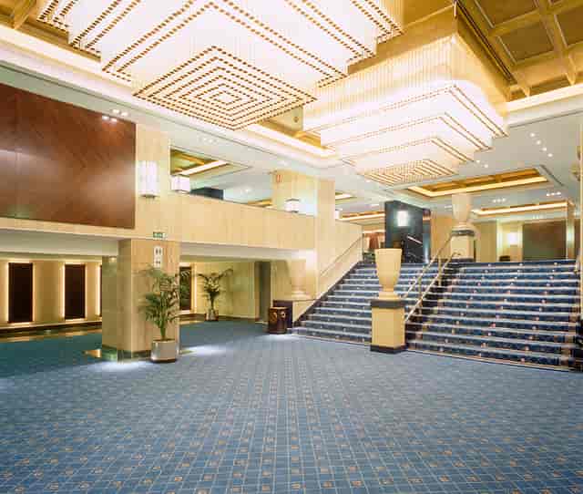 "Elegant hotel lobby with grand staircase for corporate events in Melia Castilla Madrid."