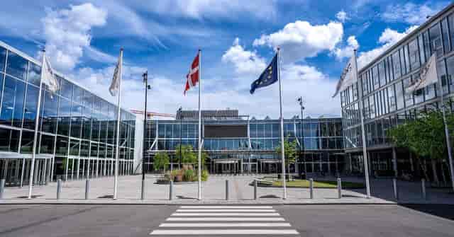 Modern Bella Center exhibition venue with glass facades, ideal for events and networking.