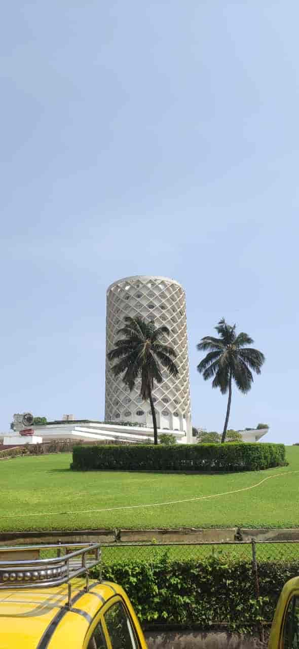 Hall of Vision Unit C, modern venue in Mumbai surrounded by palm trees for unique events.