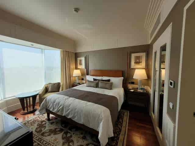 Ballroom 4 at The Leela Mumbai: elegant hotel room with king-sized bed for corporate events.