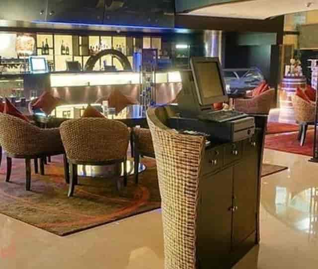 Stylish lounge area at Hotel Sahara Star for networking events, warm lighting and cozy seating.