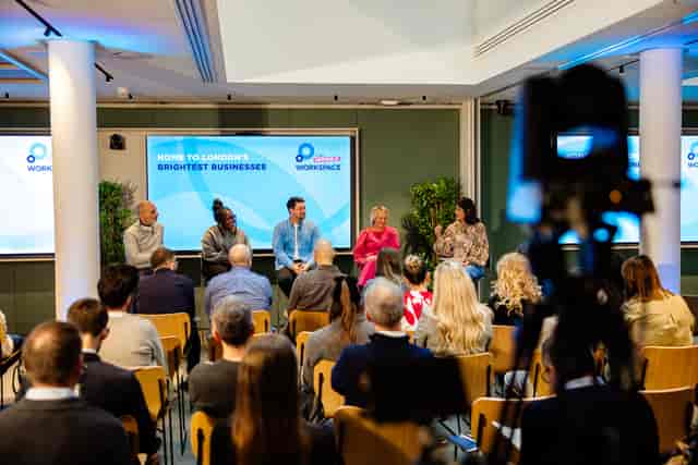 Panel discussion at Salisbury House, showcasing speakers and audience interaction for networking event.