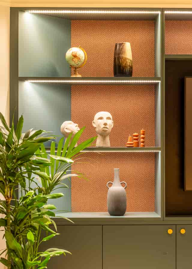 Stylish display shelf with art and greenery in Salisbury House event space for meetings.