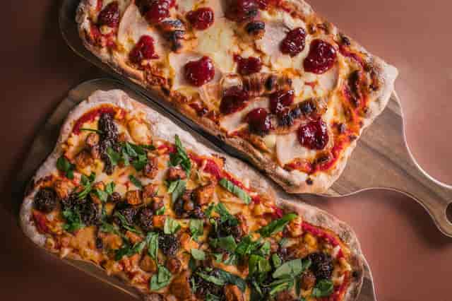 Gourmet flatbreads at a Christmas party for networking and team-building events.