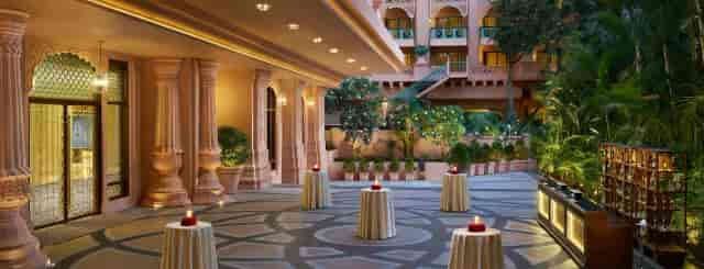 Elegant outdoor event space at The Leela Palace Bengaluru for receptions and cocktail hours.