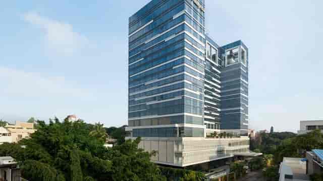 Krishna in Shangri-La Hotel Bengaluru, a modern venue for corporate events with glass windows.