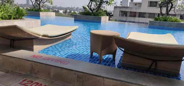 Poolside setting at Shangri-La Hotel Bengaluru for casual networking events, featuring lounge chairs.