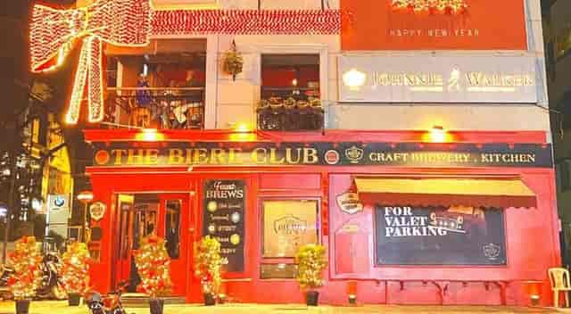 Vibrant red venue exterior at The Biere Club for events and gatherings.