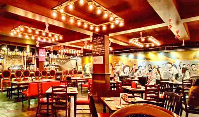 Vibrant restaurant interior with stylish bar, ideal for group gatherings and events.